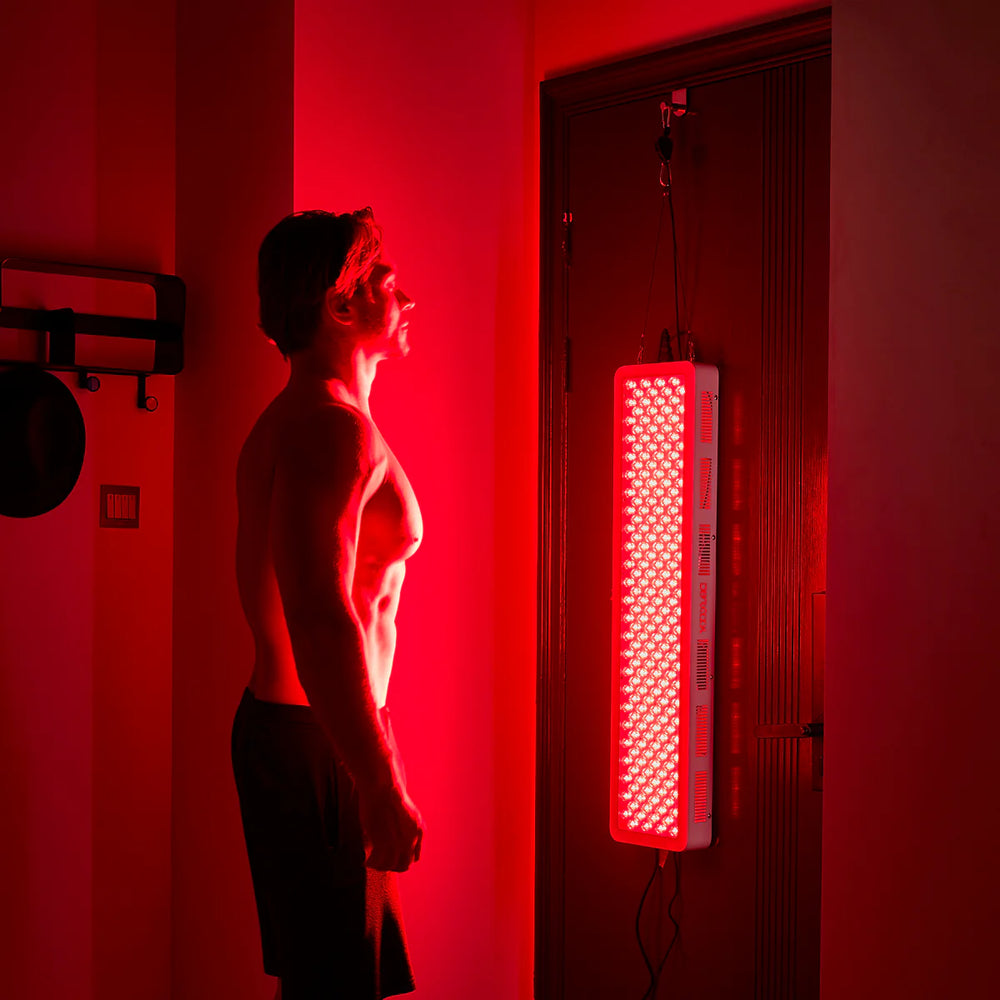 Model Standing Using Panel from Home -Bestqool Pro200 Full-Body Red Light Therapy Panel-4 Wavelengths for Advanced Treatment