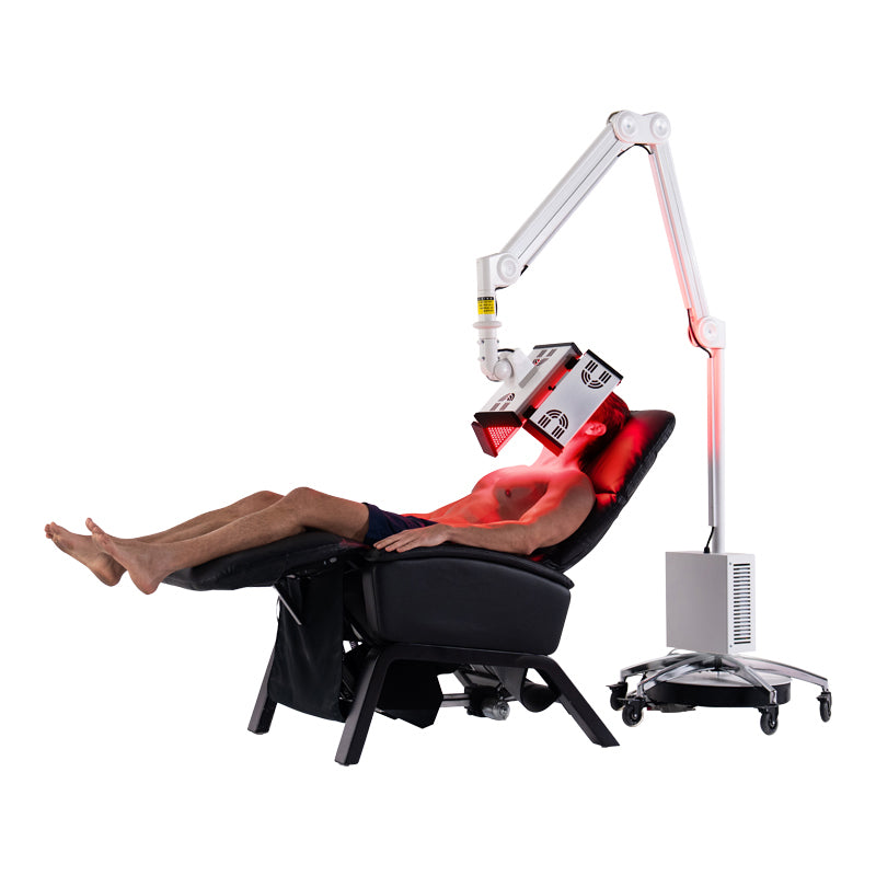 ApolloGlow facial red light therapy panel positioned over recline client during a treatment session on a white studio background