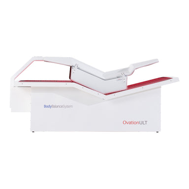 Body Balance System OvationULT Red Light Therapy Bed – front view with canopy closed and red light panels illuminated for full-body wellness treatment.