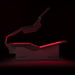 Body Balance System PremierRLT red light therapy bed with canopy open and LEDs glowing on a dark background