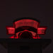 Woman using Body Balance System PremierRLT red light therapy bed with canopy closed LEDs illuminated in dark setting