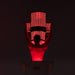 Man using Body Balance System PremierRLT red light therapy bed with canopy LEDs illuminated in dark setting