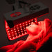 Model Receiving Treatment - Body Balance System ApolloGLOW with Adjustable Arm Wheeled Red Light Therapy Device Targeted for Facial Rejuvenation Treatment 