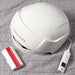 Top view of iRestore Essential Laser Hair Growth System helmet with handheld controller on white background
