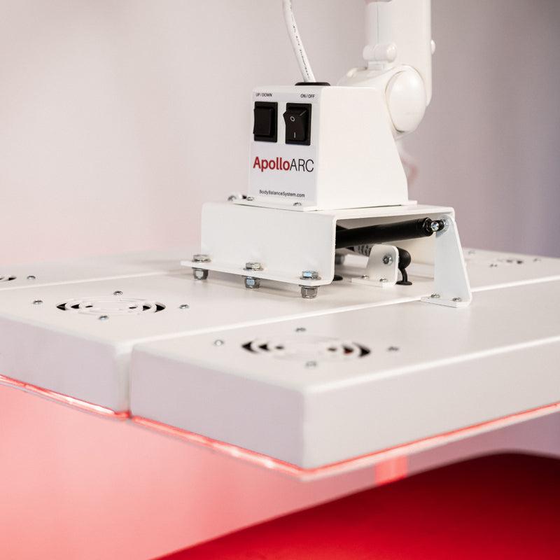 Close-up of the Body Balance System ApolloARC red light therapy panel control box and mounting hinge