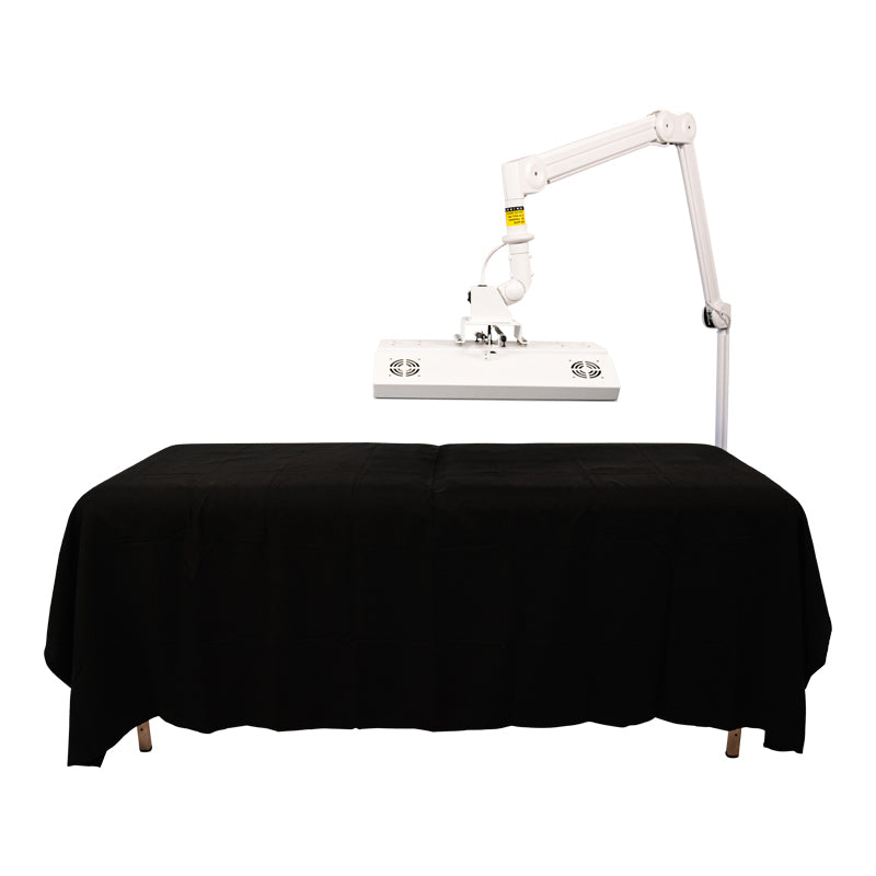 Body Balance System ApolloARC red light therapy panel mounted over a treatment table on adjustable arm