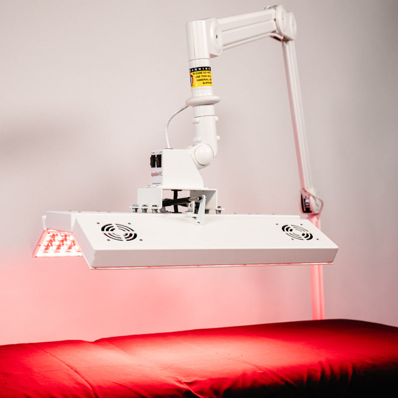 Angled view of the Body Balance System ApolloARC red light therapy panel positioned over treatment table