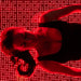 Female model lying on Body Balance System OvationLITE red light therapy bed with LEDs illuminated