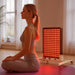 Model Using The Product at Home - BestQool Adjustable Mobile Stand - Compatible with Pro Series Red Light Therapy Panels