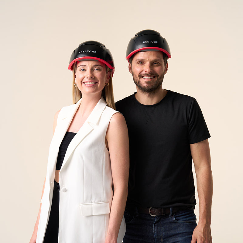 iRestore Elite laser hair growth helmet shown on male and female models.