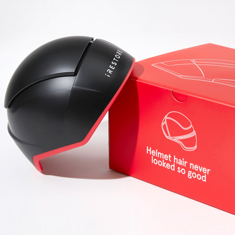 iRestore Elite laser hair growth helmet shown with retail packaging.