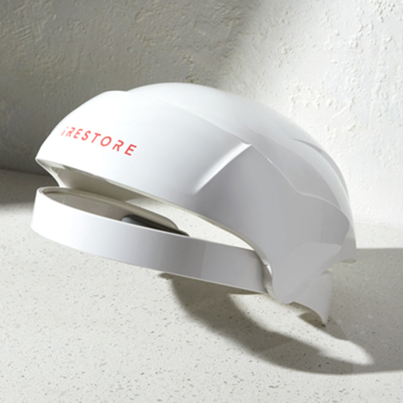 iRestore Essential laser hair growth helmet hero image angled view white background.
